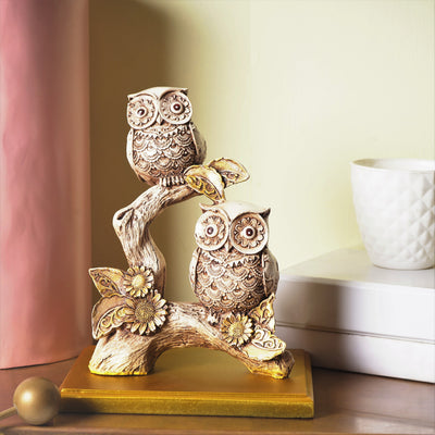 Rustic Owls Perched on a Branch